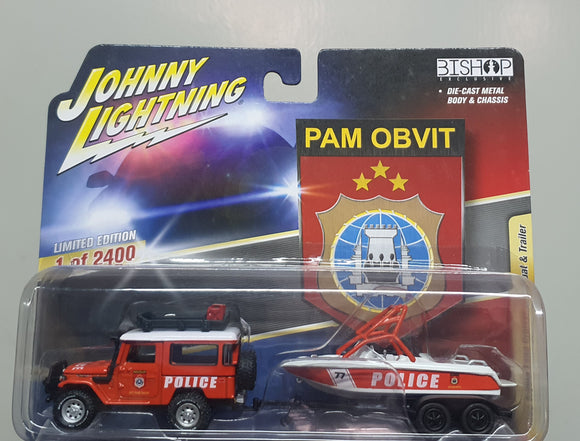 1:64 Johnny Lightning Toyota LandCruiser w Police Boat & Trailer